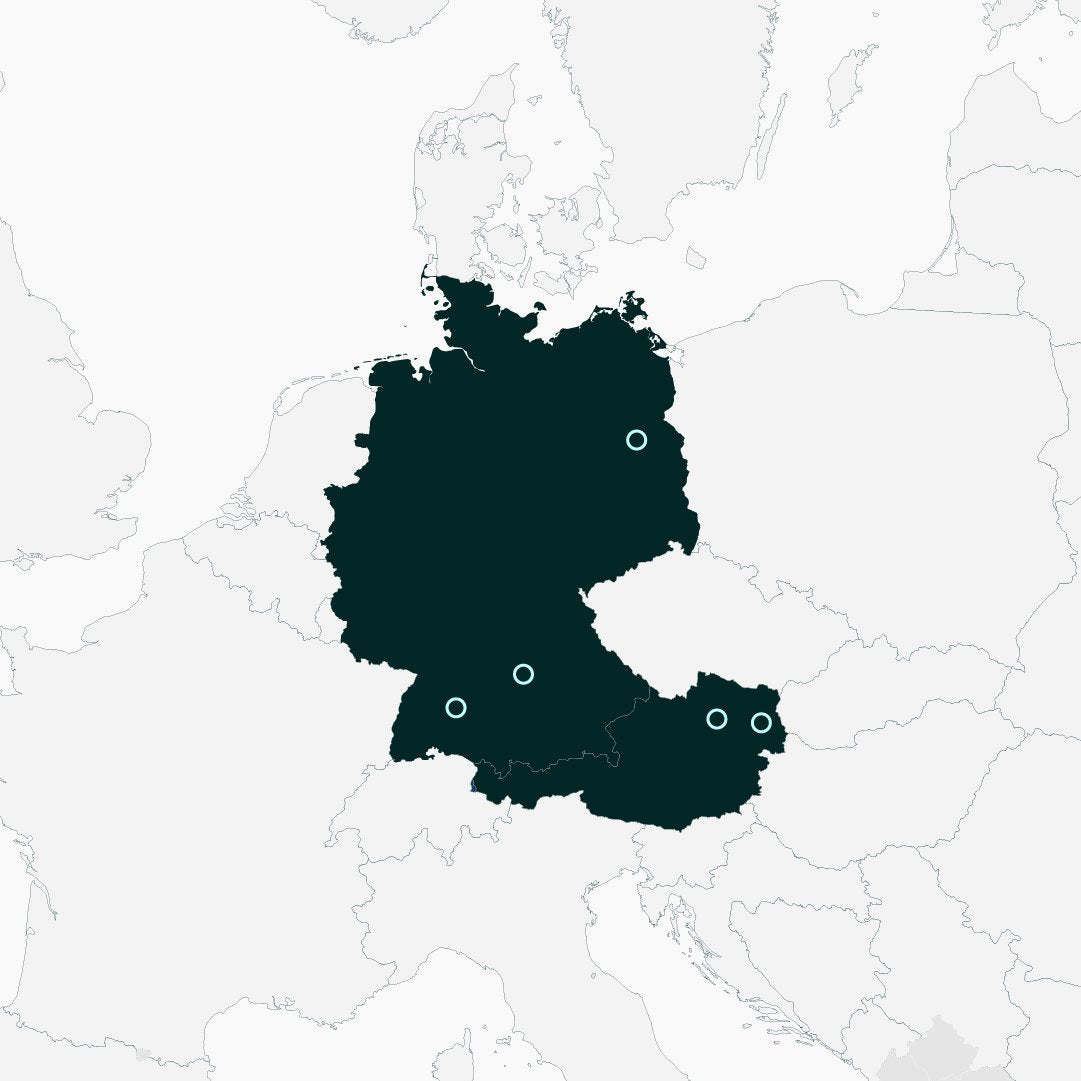 Map of central Europe, with Germany and Austria in dark green, and the surrounding countries in gray with a thin border. Turquouise circles are on two cities in Germany, and one in Austria, showing Poler Embassy's supply chain.