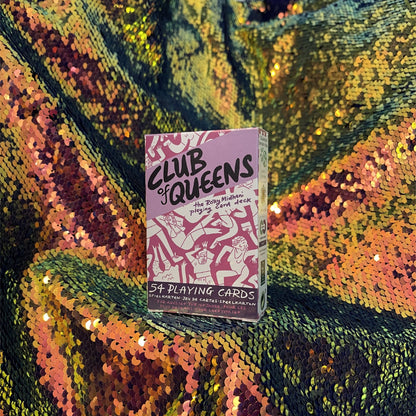 Club of Queens playing cards against a yellow-blue-green sequined background.