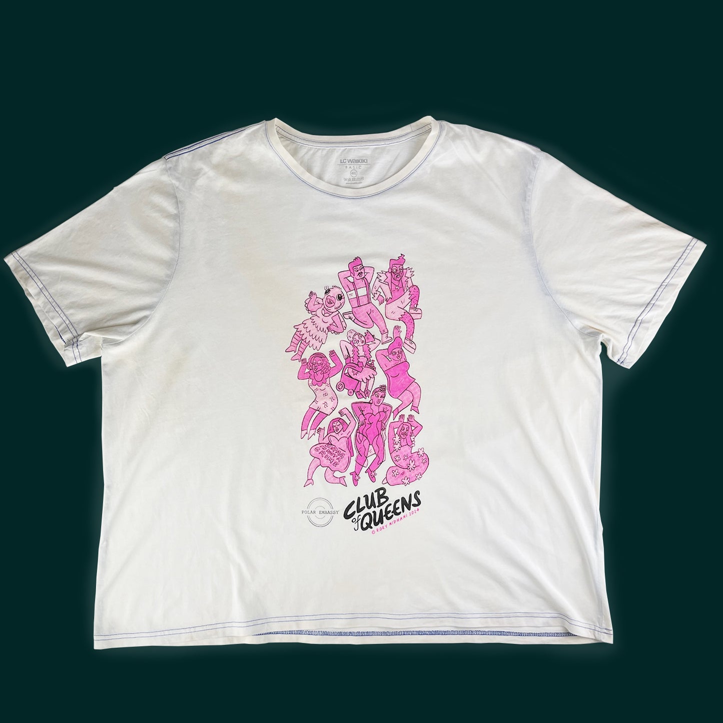Nine pink drag queens and kings are hand-screen printed on a 4XL white shirt on a dark green background. The Polar Embassy logo and "Club of Queens, Rory Midhani 2024" are below the graphic.