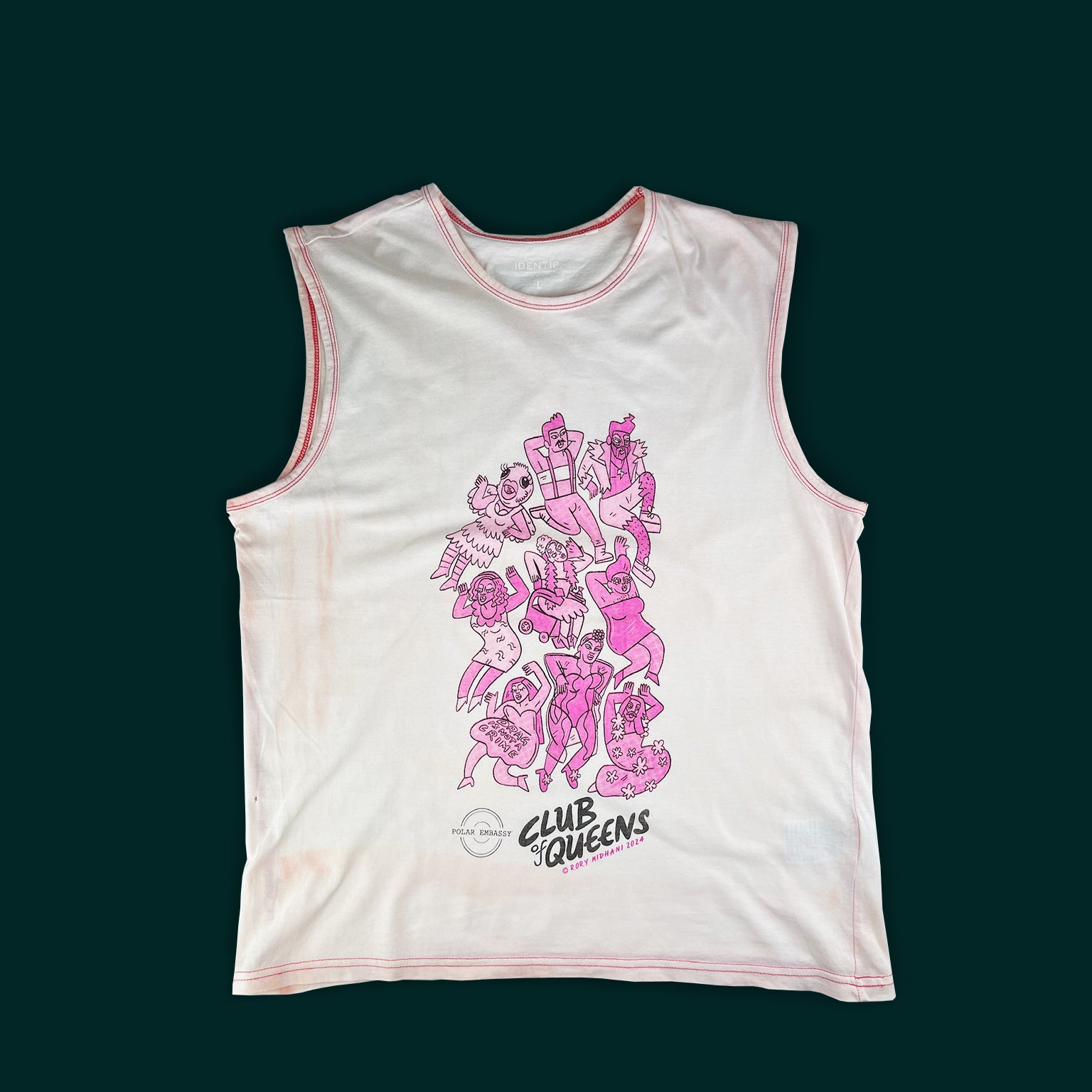 Nine pink drag queens and kings are hand-screen printed on a large light pink tank top on a dark green background. The Polar Embassy logo and "Club of Queens, Rory Midhani 2024" are below the graphic.