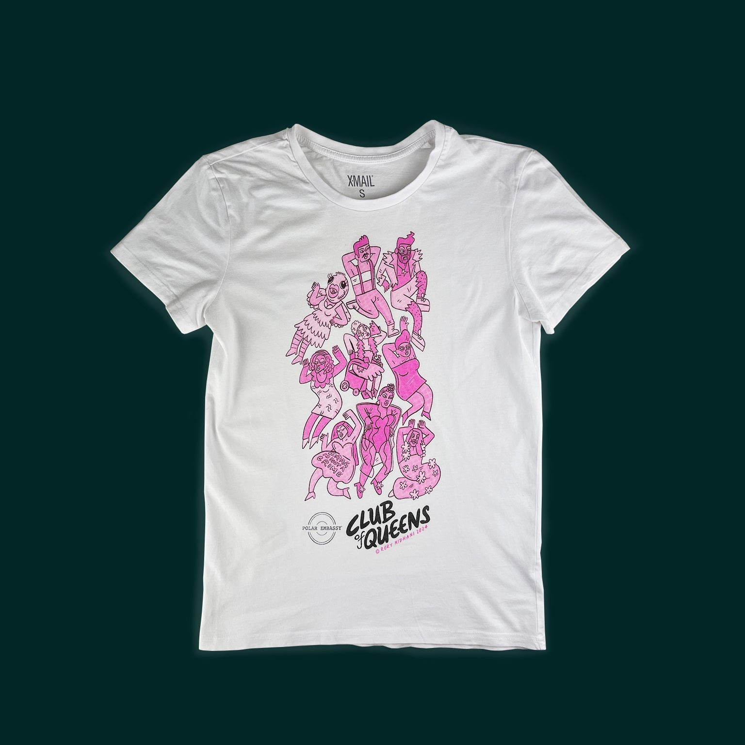 Club of Queens drag queen motif on a white shirt: nine pink drag queens and kings are hand-screen printed on a small white shirt on a dark green background. The Polar Embassy logo and "Club of Queens, Rory Midhani 2024" are below the graphic.