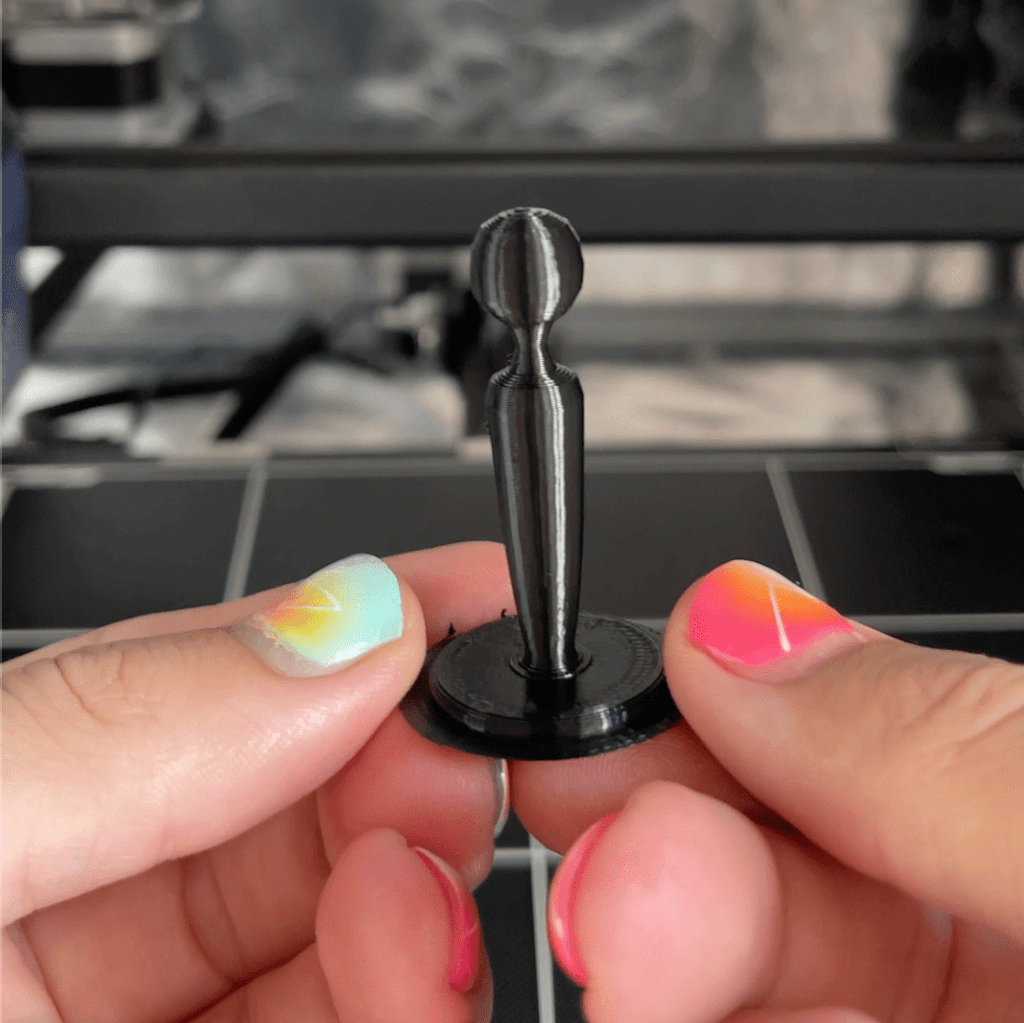 Black 3D printed chess piece king from sex toy chess set shaped like a wand vibrator